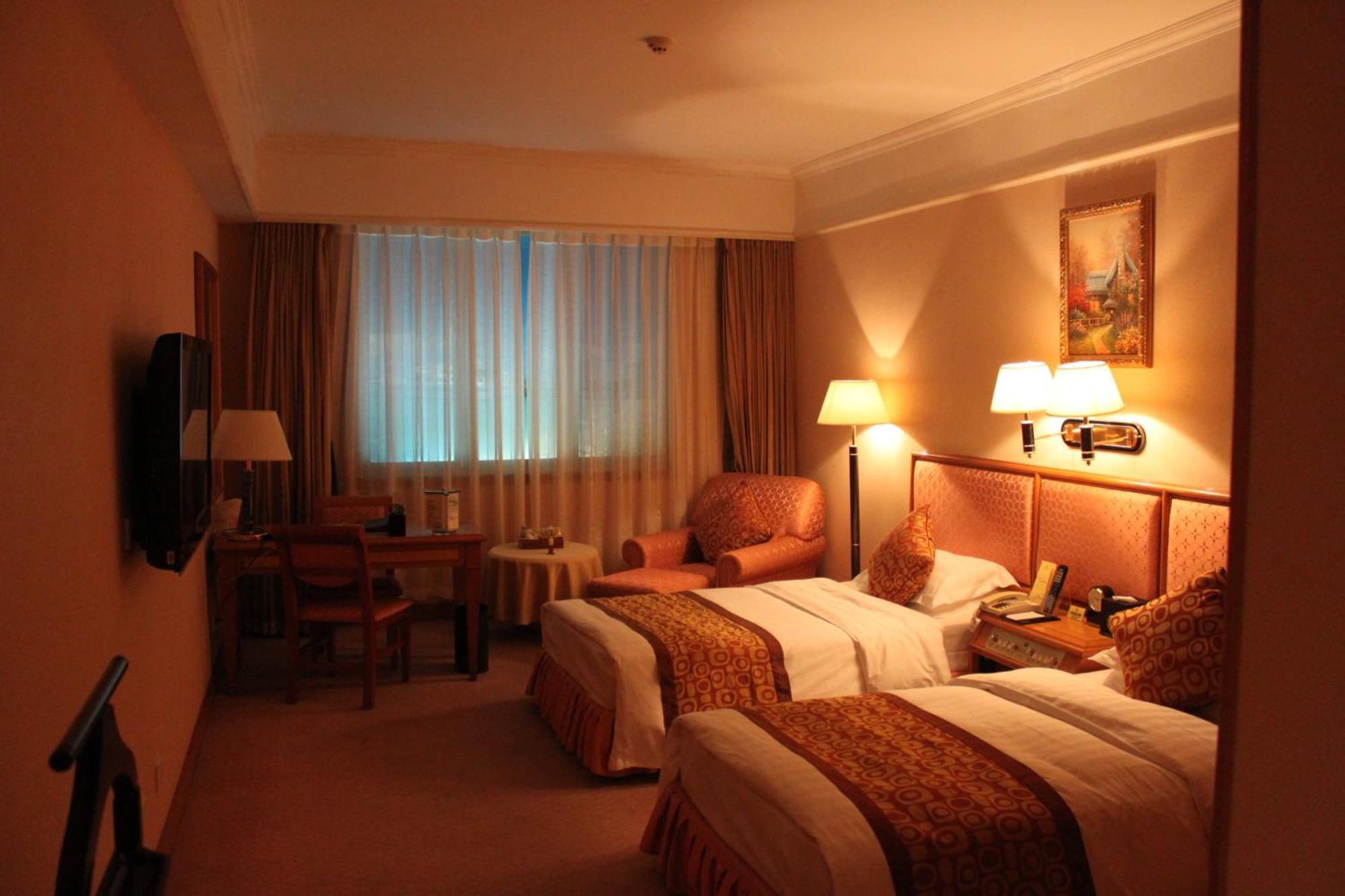 Qingdao Oceanwide Elite Hotel Rum bild