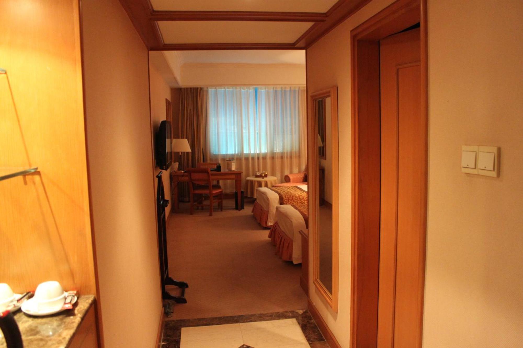 Qingdao Oceanwide Elite Hotel Rum bild